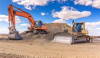 What is the difference between an excavator and a backhoe?
